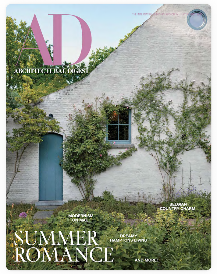 AD magazine cover with a white house covered in vines.